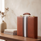 Signature Backgammon No. 1 — lifestyle, closed cognac case displayed on a walnut console
