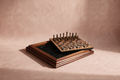 Wooden Inlay Chess, 14 inch wooden case open with inlaid burl playing field and metal pieces in a felt-lined tray