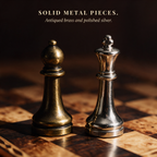 Close-up of solid metal chess pieces in antiqued brass and polished silver