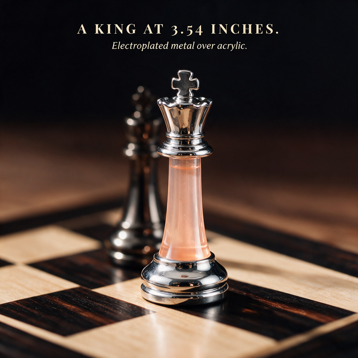 Close-up of the chess king, chrome crown and foot over a pale acrylic stem